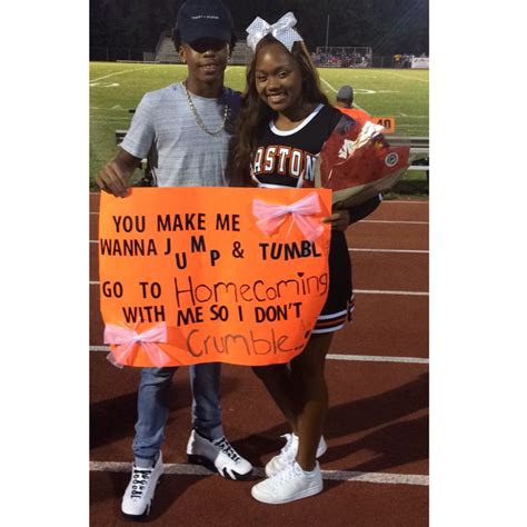 Let's hear it for the Trojans. . Cheerleading homecoming proposals